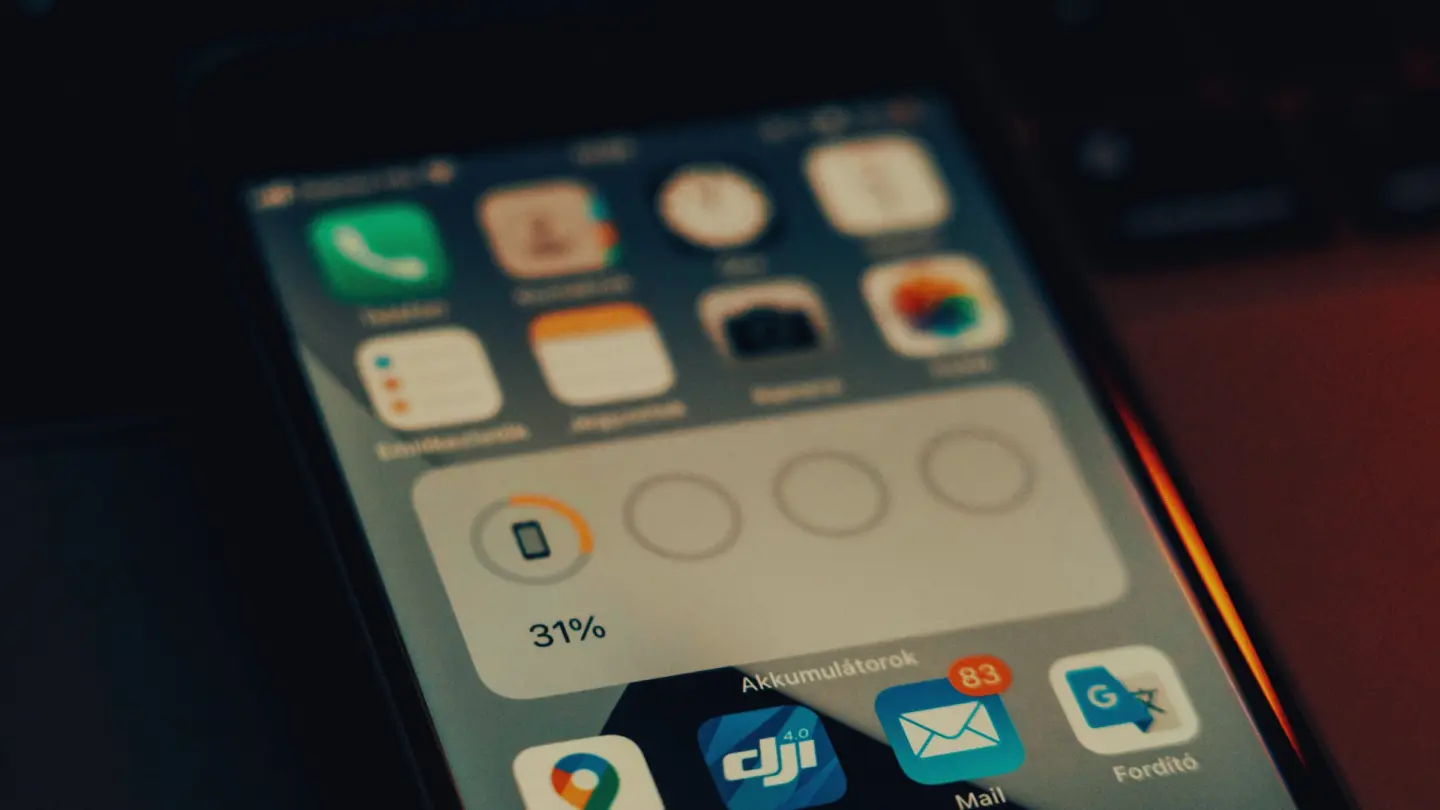Photo of an iPhone screen showing a battery level widget, used to illustrate a story about iPhone 18 Pro's rumored battery specs