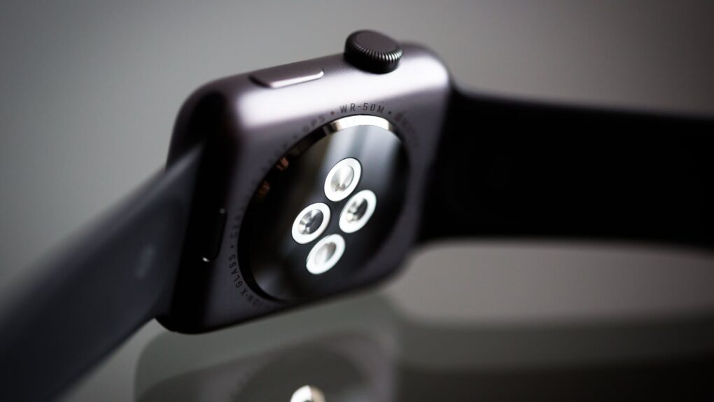 Photo of back side of an Apple Watch, showing sensors that power heart rate monitor and more