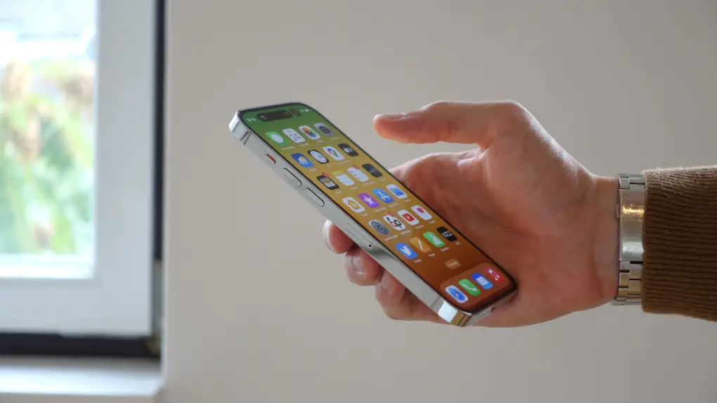 A photo showing an iPhone in a person's hand used in a story about iPhone price increase.