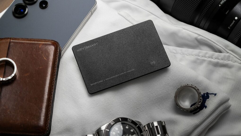 A tracking card along with other important items on top of off-white clothing.