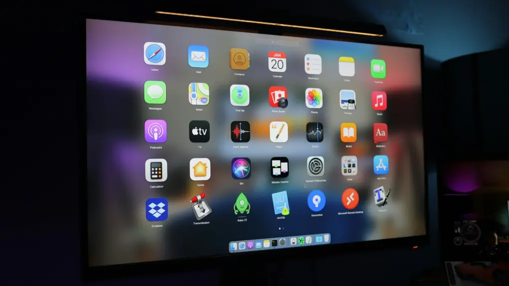 Photo of an Mac desktop with various apps on it.