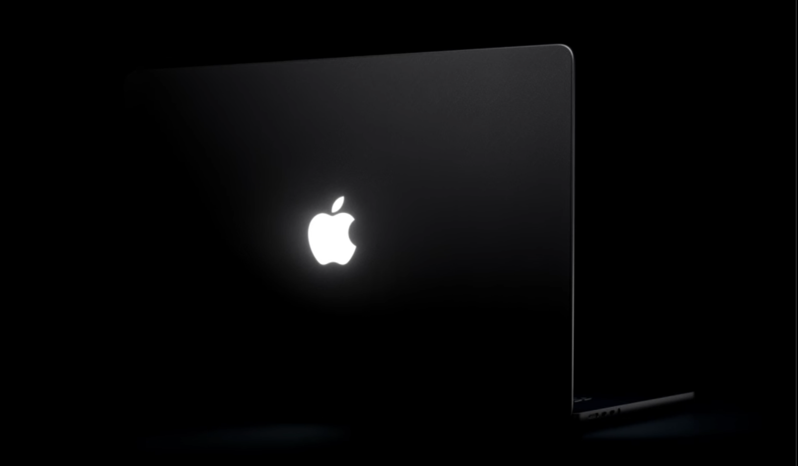 MacBook Pro glowing Apple logo Glowing Apple logo on touchscreen MacBook Pro.