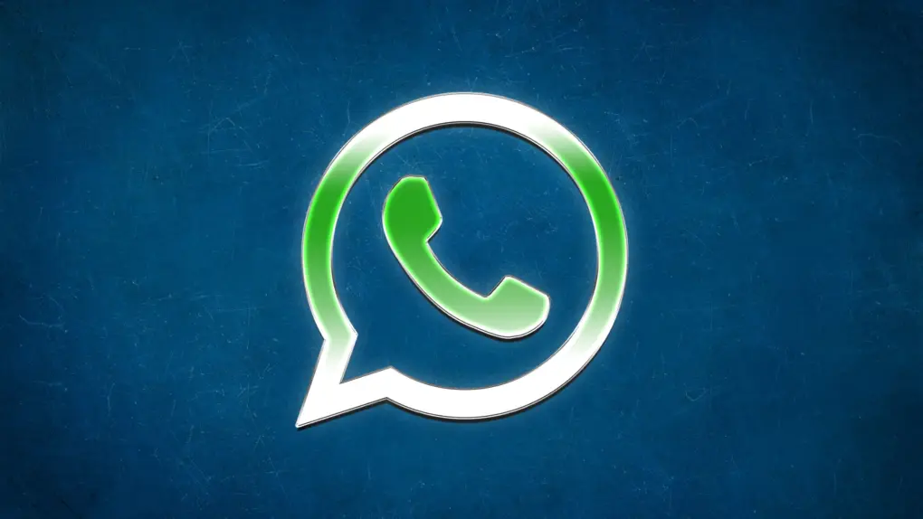 WhatsApp logo with background used in a story about WhatsApp finally bringing Liquid Glass interface to its built in video player.